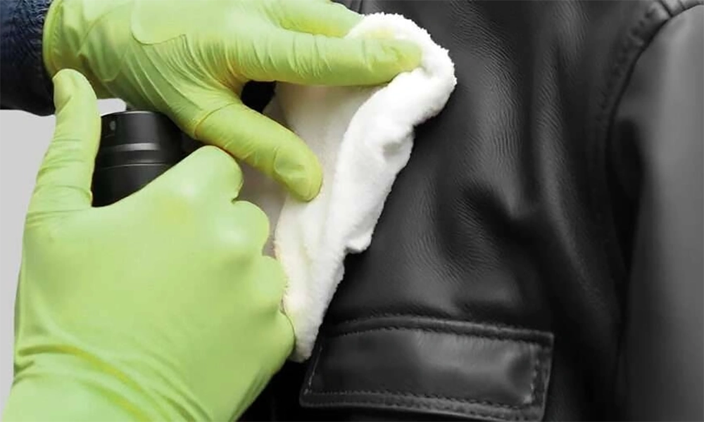 applying leather conditioner with sponge