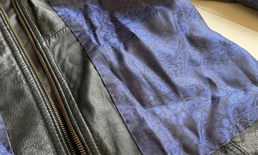 black leather jacket with blue paisley lining