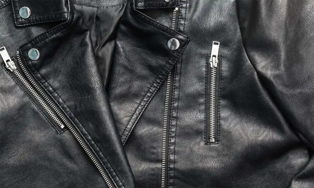 close up black leather jacket zippers