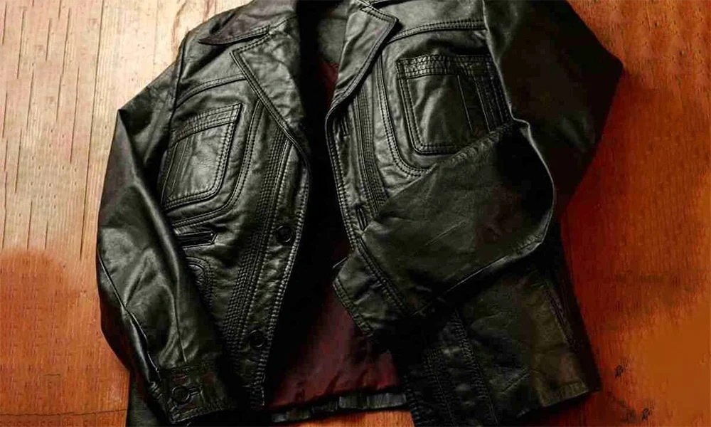 folded black leather jacket with pockets