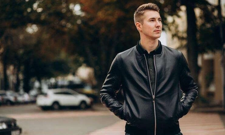 man walking in black leather jacket