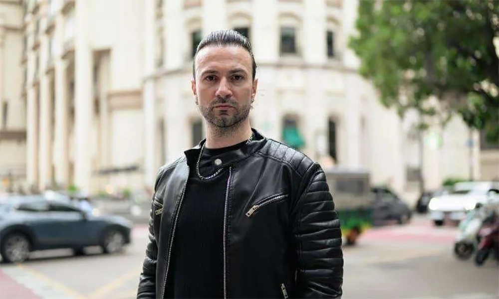 man-with-ponytail-in-black-leather-jacket