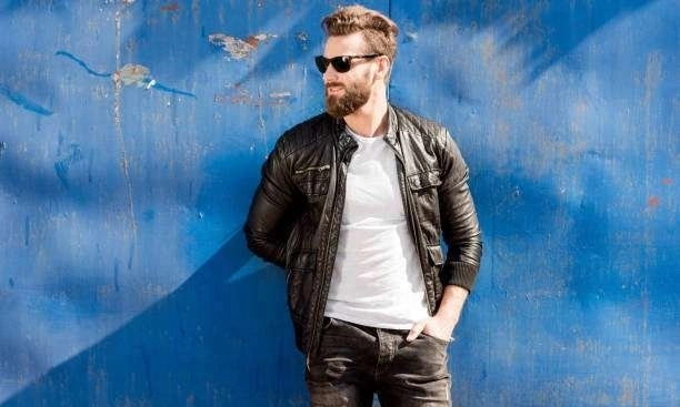 man with sunglasses wearing black leather jacket