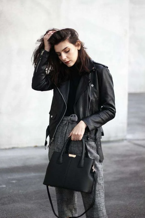 woman in black leather jacket