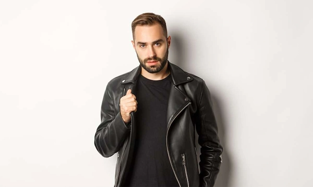 man with beard black leather jacket